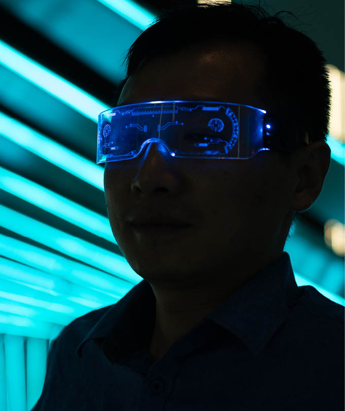 Asian man using virtual reality glasses