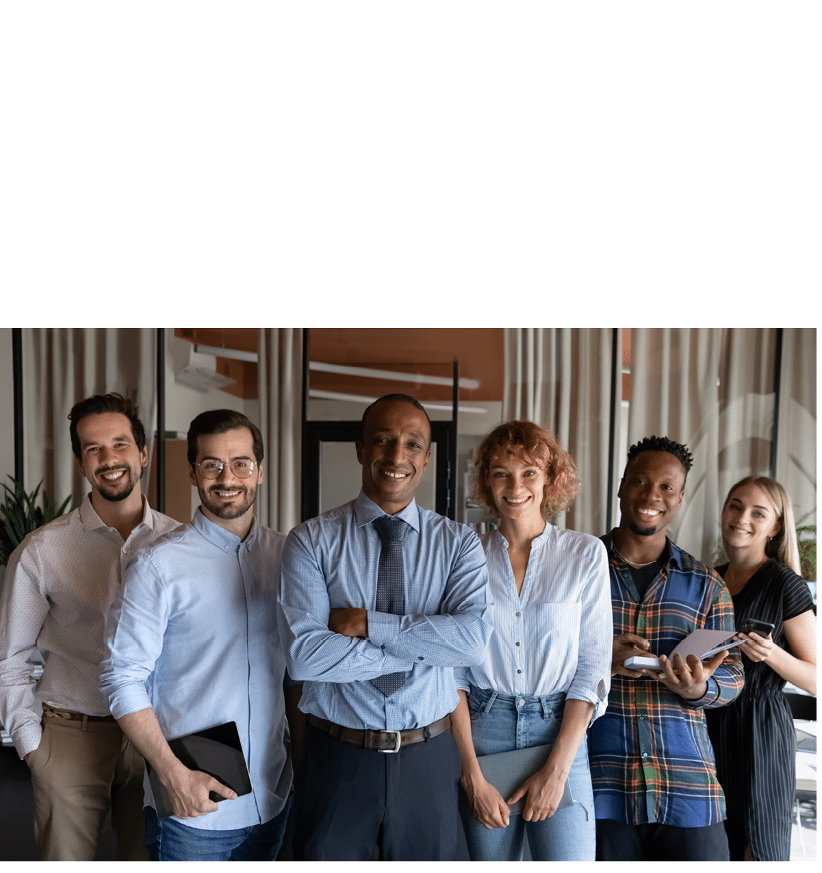 Business people brainstorming in conference room with adhesive notes.
