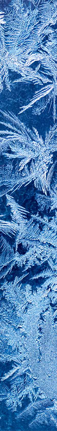 Frosty winter pattern at a window glass, macro texture