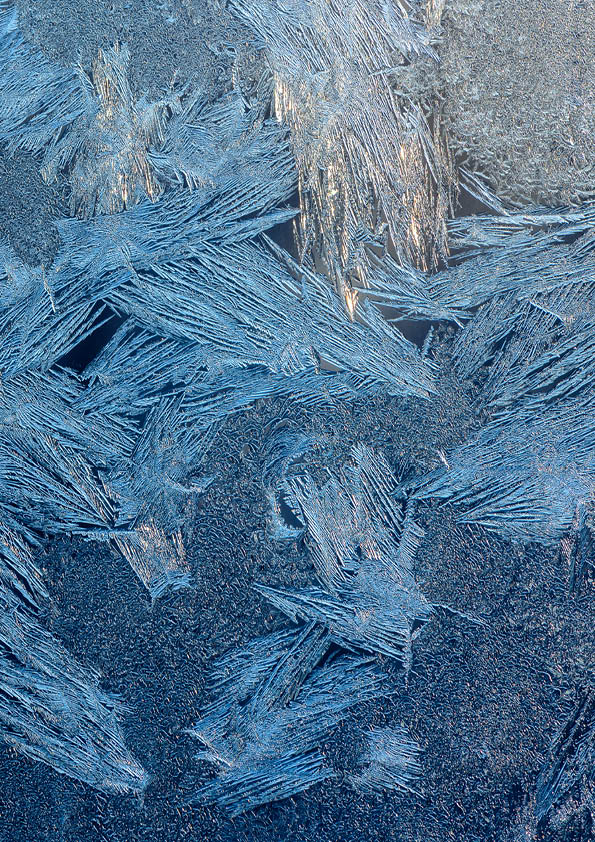 Texture of ice with blue back light. Abstract background
