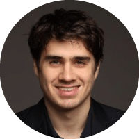 A man with a beard and mustache wearing a blue shirt. Description generated by AI