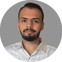 A man with a beard and mustache wearing a blue shirt. Description generated by AI