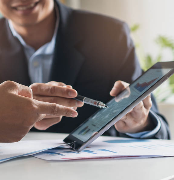 financial advisory services. Asian advisor showing plan of investment to clients in the consultancy office.