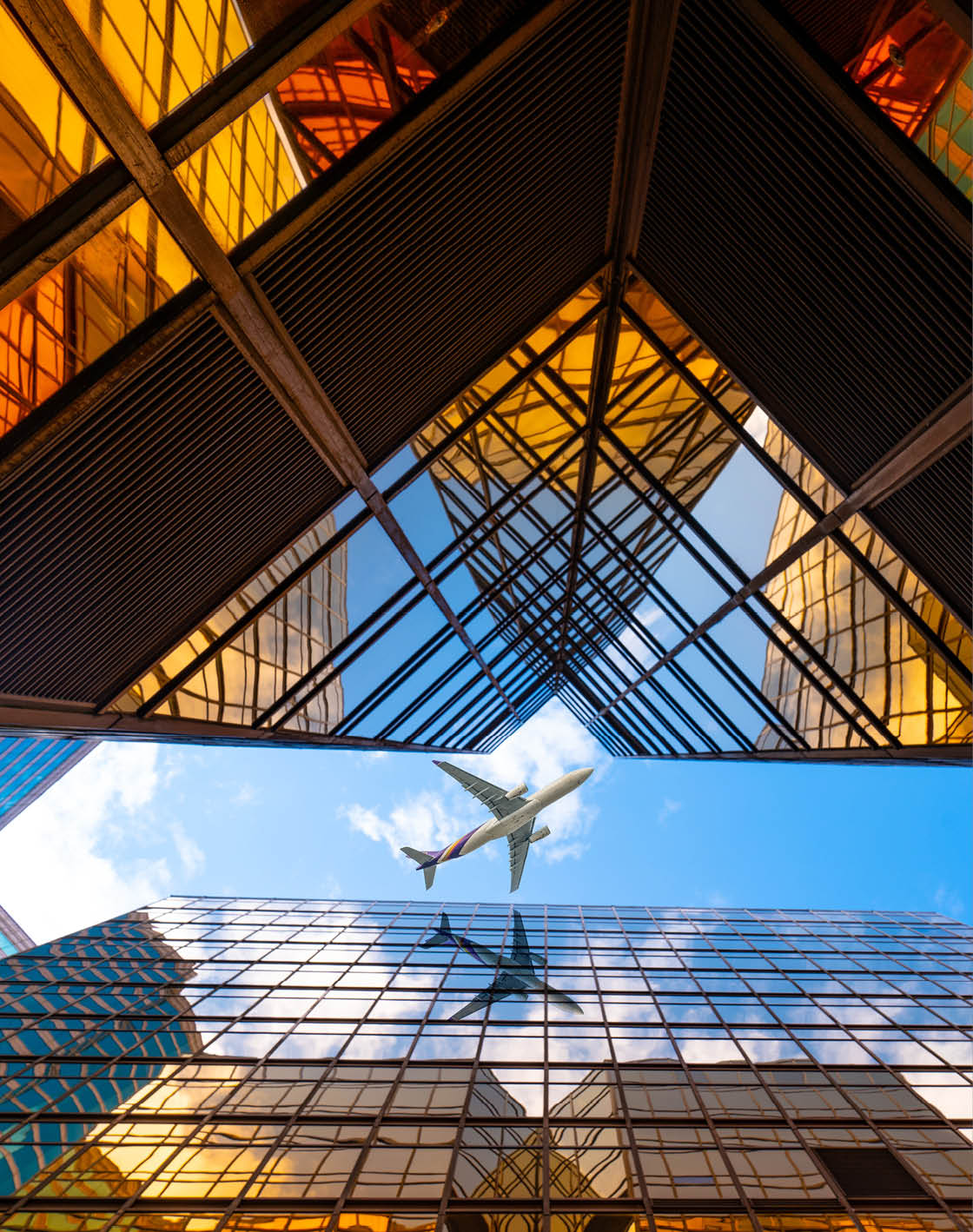 A plane flying over a city with tall buildings. AI generated content