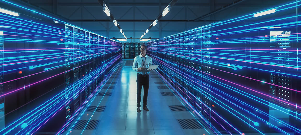 Futuristic Concept: Data Center Chief Technology Officer Using Laptop, Standing In Warehouse, Information Digitalization Lines Streaming Through Servers. SAAS, Cloud Storage, Online Service